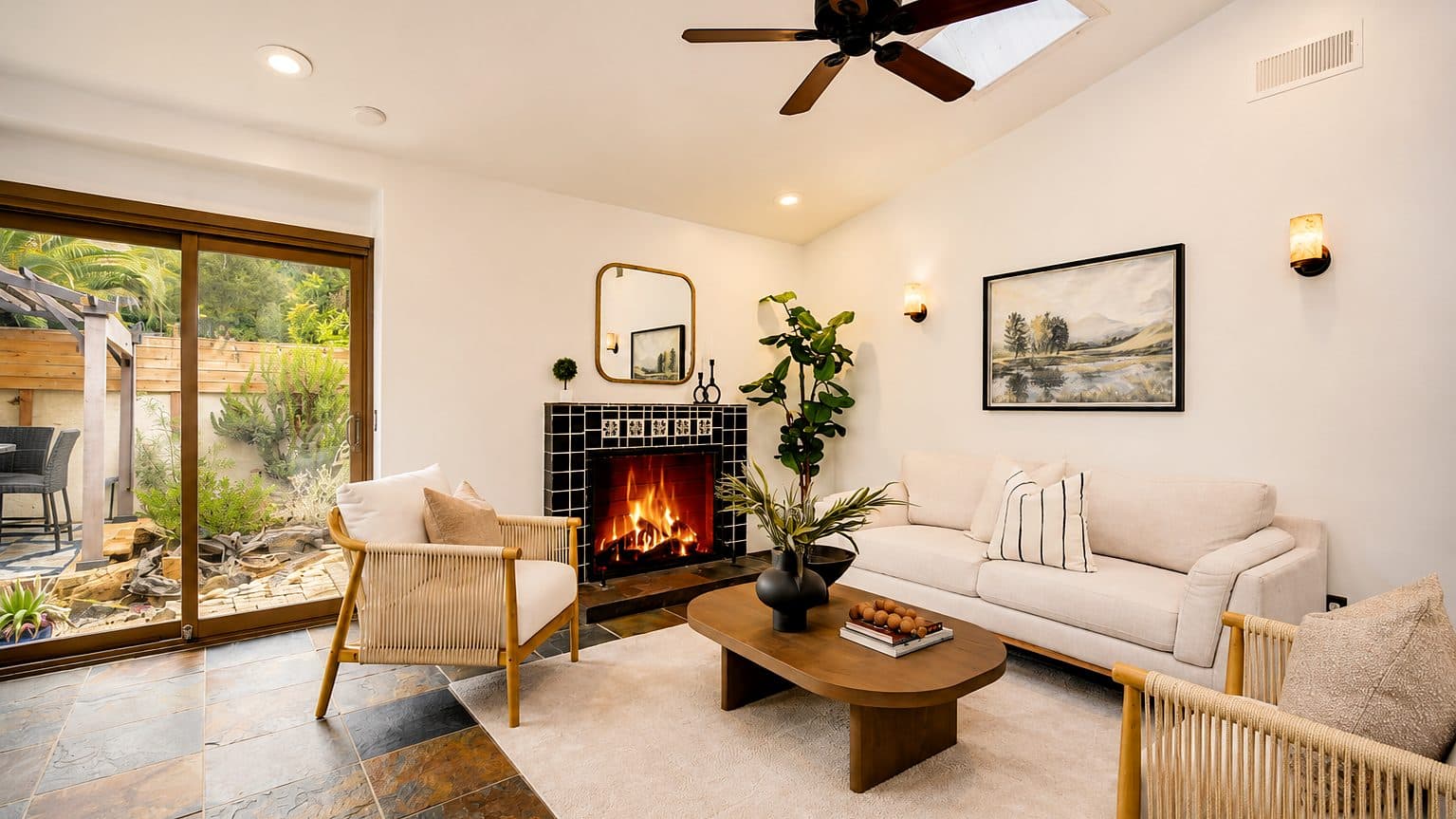 Bright living room with a tiled fireplace in a San Clemente home