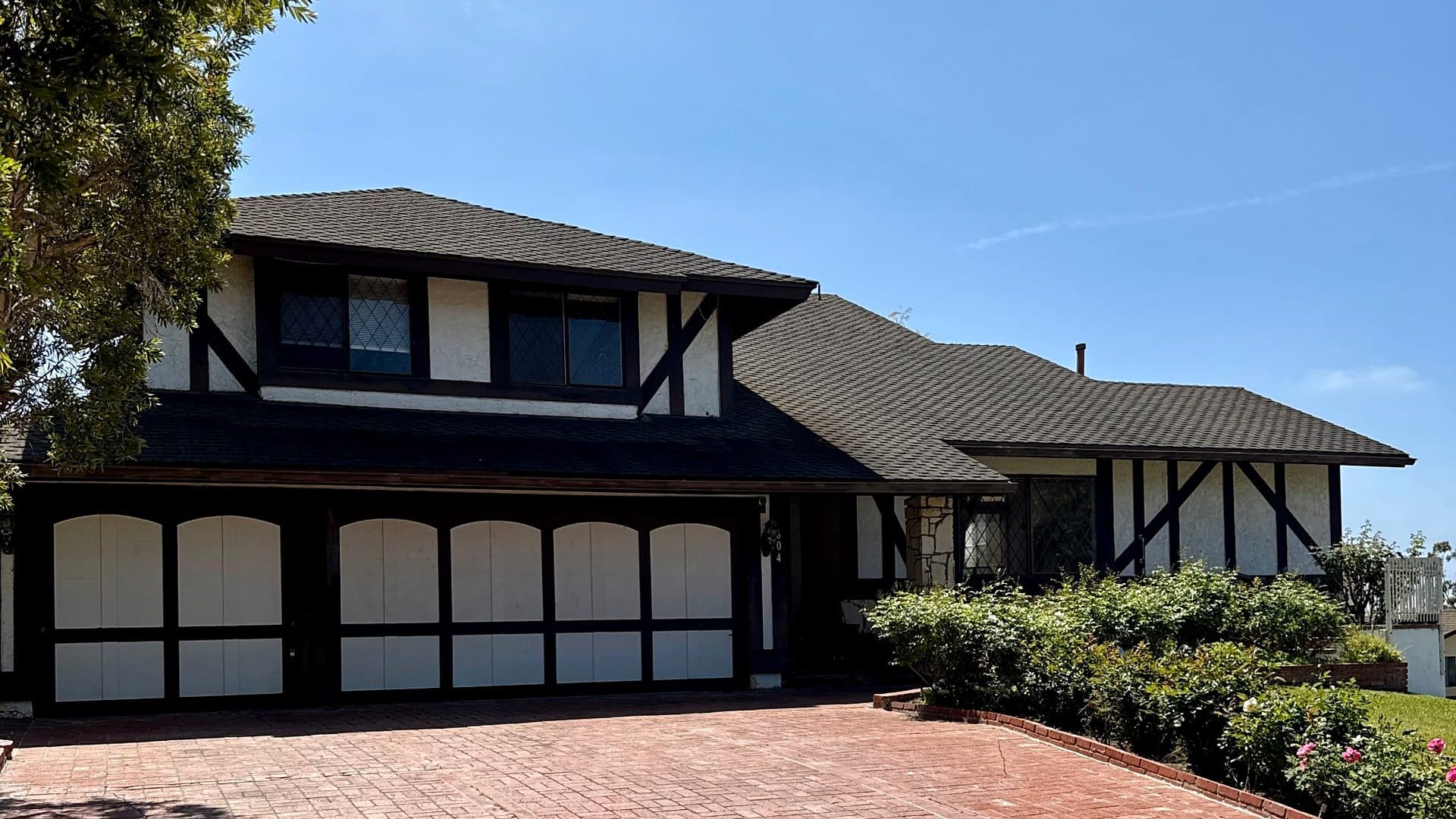 San Clemente home with a brick driveway